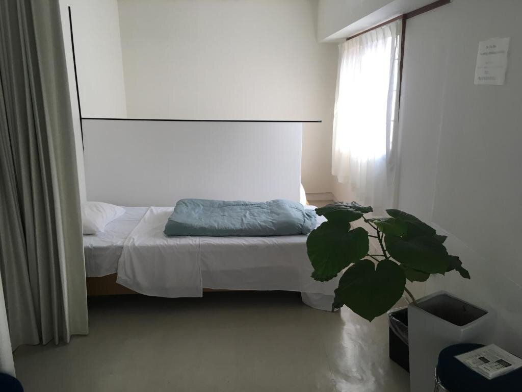 Кровать в общем номере Guest House M104 Kagoshima