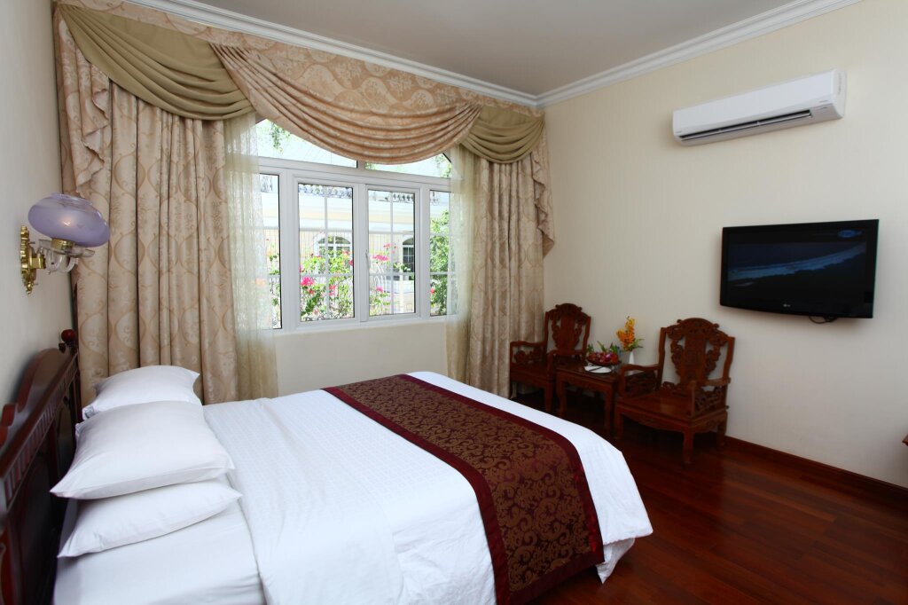 Deluxe chambre Vue jardin Hotel Continental Saigon