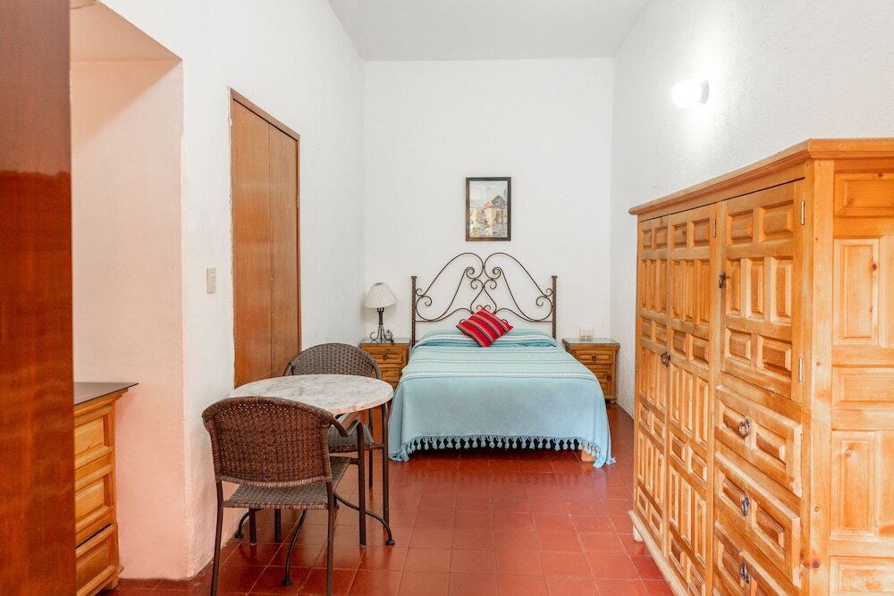 Кровать в общем номере Hotel Posada del Centro