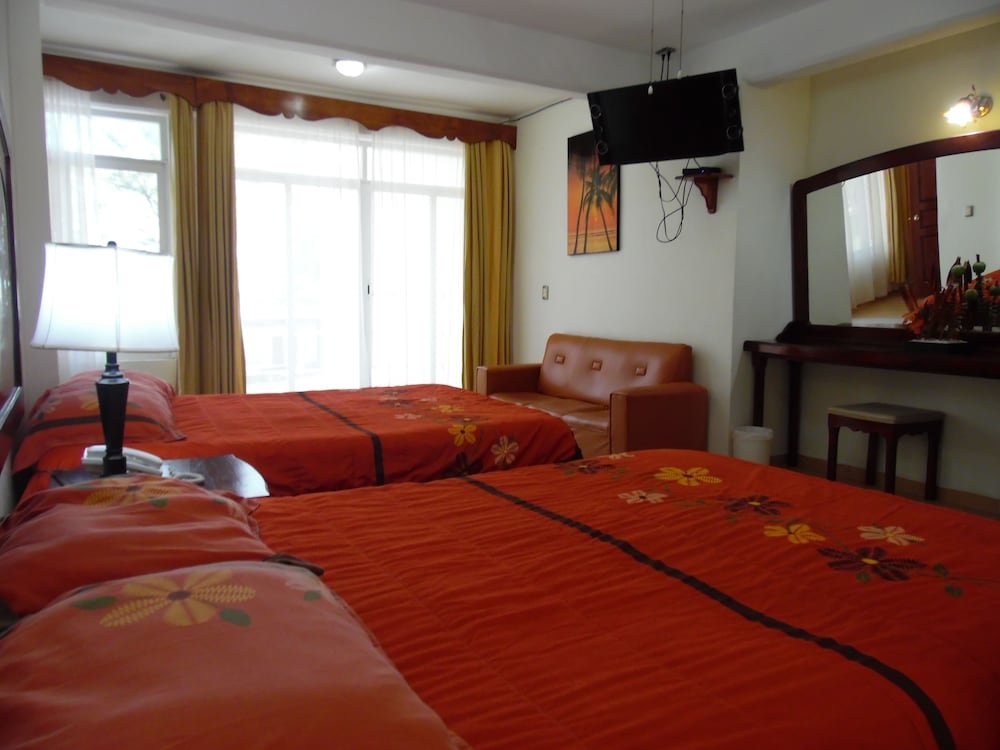 Habitación cuádruple Estándar 1 dormitorio con vista parcial al océano Hotel El Jardin Resort