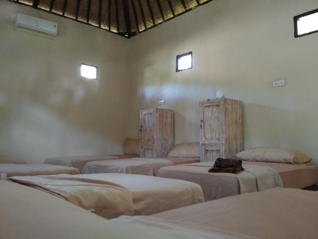 Кровать в общем номере Apit Lawang Villas & Resto