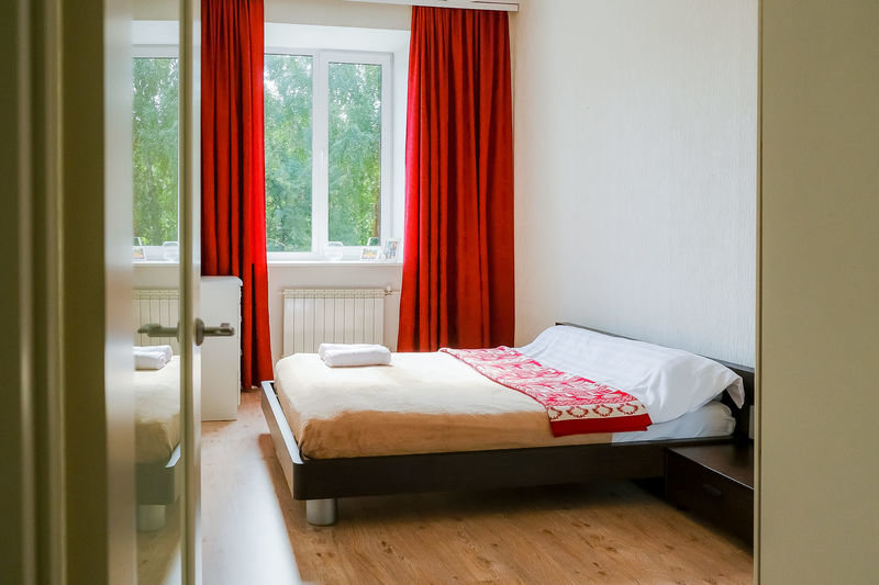 Bett im Wohnheim 2 Schlafzimmer UNIQUE APART Na Vesenney 7 Apartments