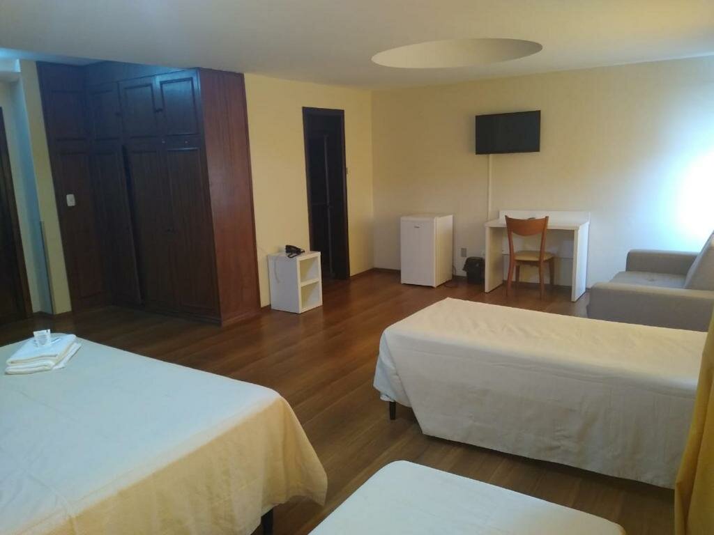 Deluxe quadruple chambre Hotel Letto Caxias