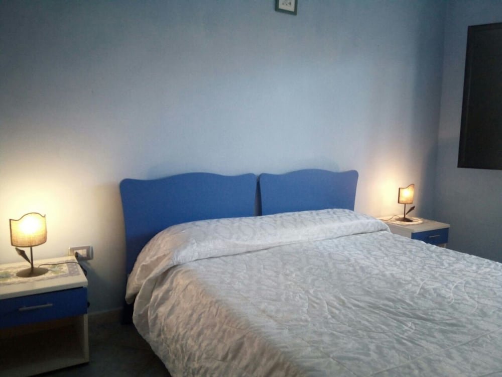 Cama en dormitorio compartido 3 habitaciones Sa Domu Sarda - Apartment With Terrace 1