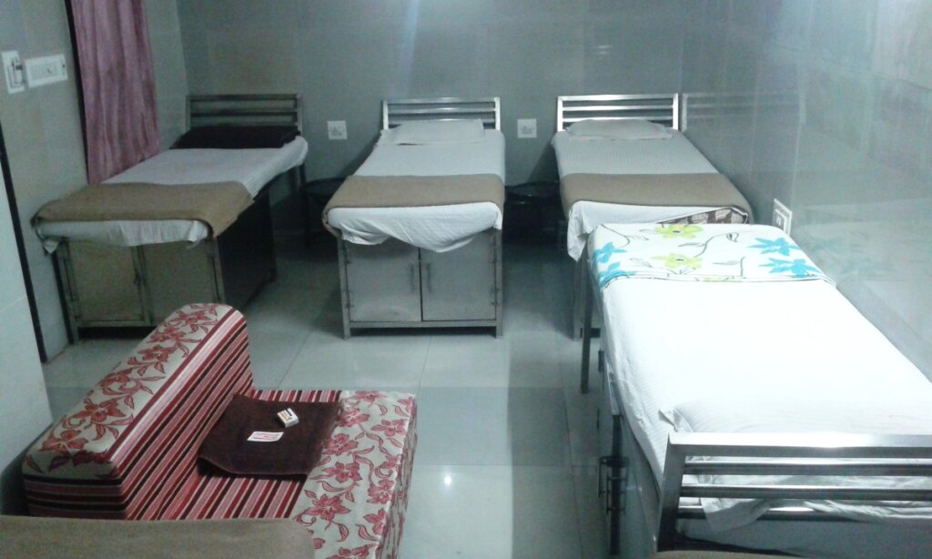 Кровать в общем номере Hotel Chatako