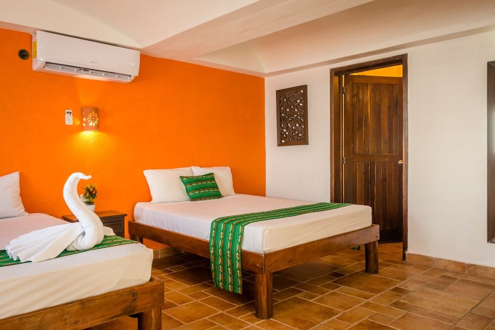 Standard Quadruple room beachfront Hotel Caleta Tankah