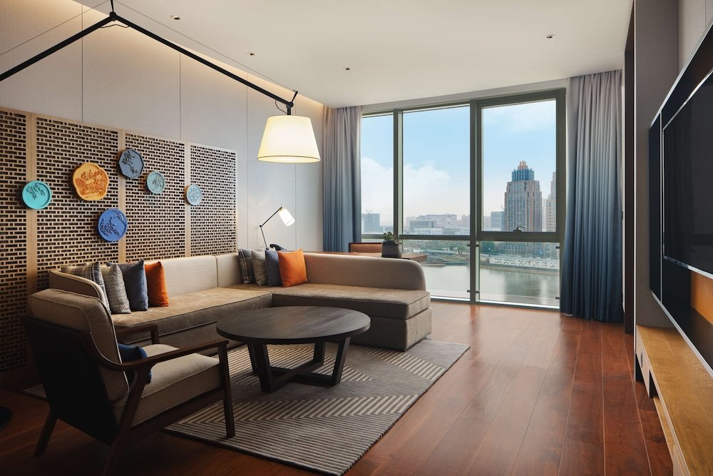 Deluxe Suite with lake view Canopy By Hilton Hangzhou Jinsha Lake