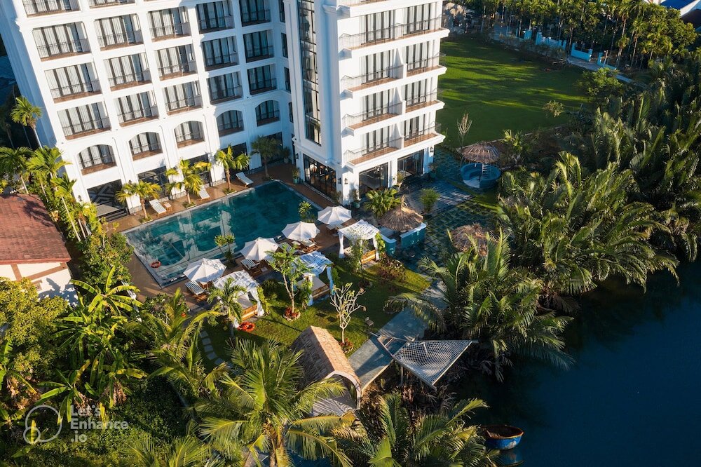 Habitación De lujo con balcón y con vista a la piscina Shining Riverside Hoi An Boutique & Spa