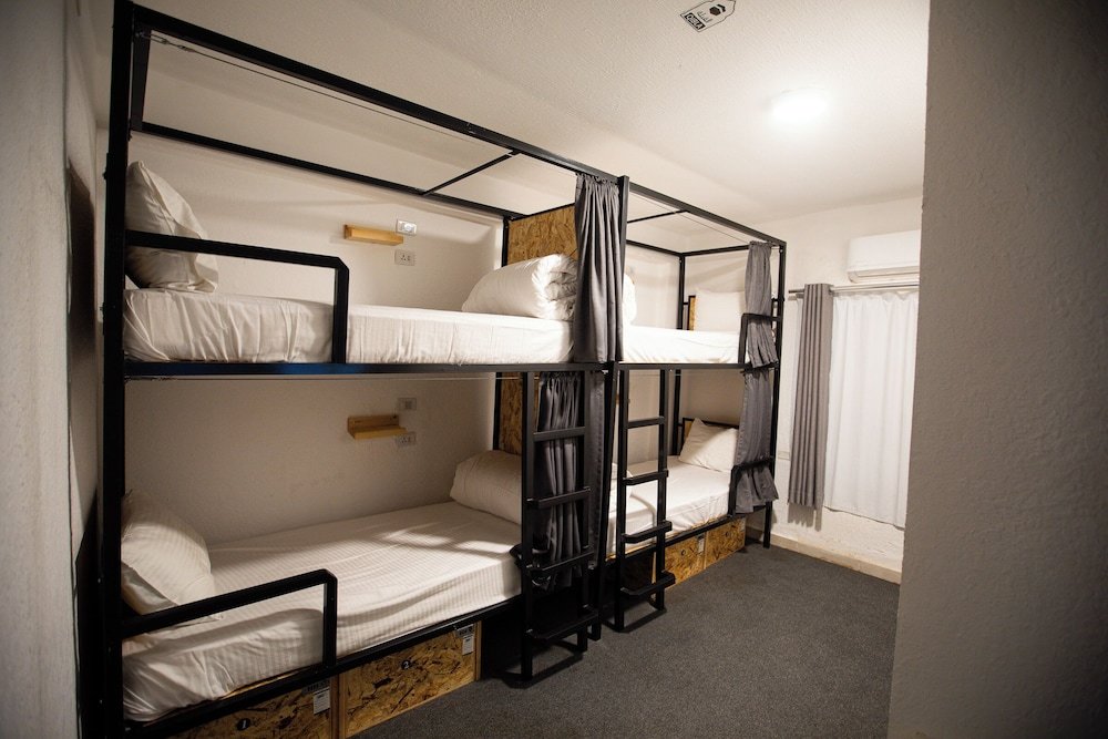 Cama en dormitorio compartido Nomads Hotel Petra