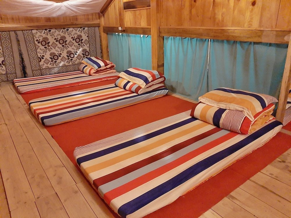 Кровать в общем номере Po Mu House