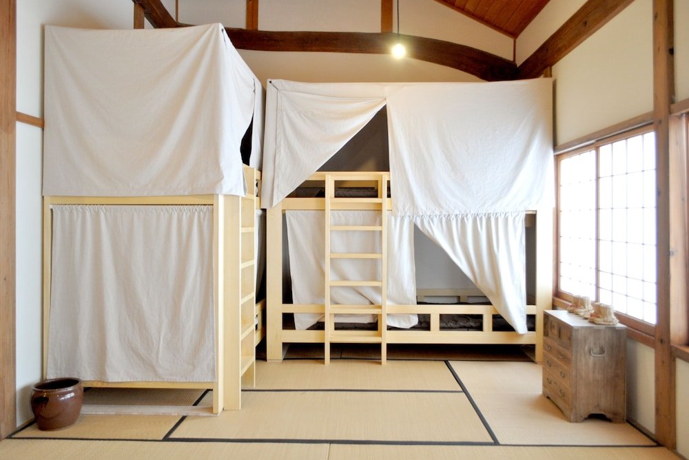 Кровать в общем номере Guest House Takazuri-KITA