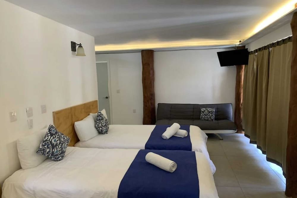 Deluxe Vierer Zimmer mit Gartenblick HOTEL & BEACH CLUB OJO DE AGUA