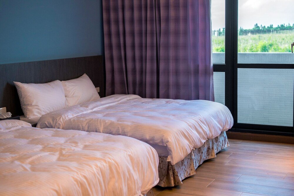 Standard Vierer Zimmer mit Balkon und mit eingeschränktem Meerblick Penghu oosleep homestay