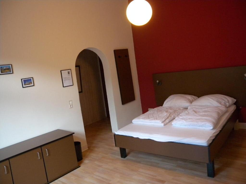 Habitación cuádruple Clásica con balcón Hostel Goslar
