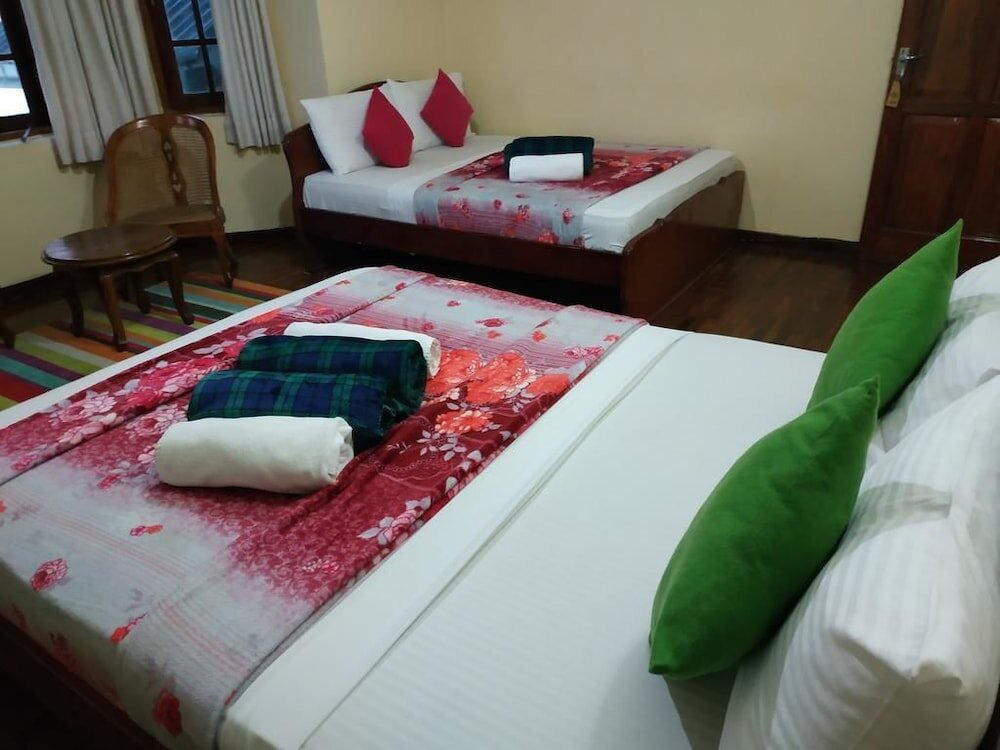 Standard quadruple famille chambre Comfort inn & Hostel