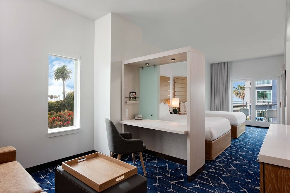 Premium Quadruple room with balcony and with partial ocean view SpringHill Suites