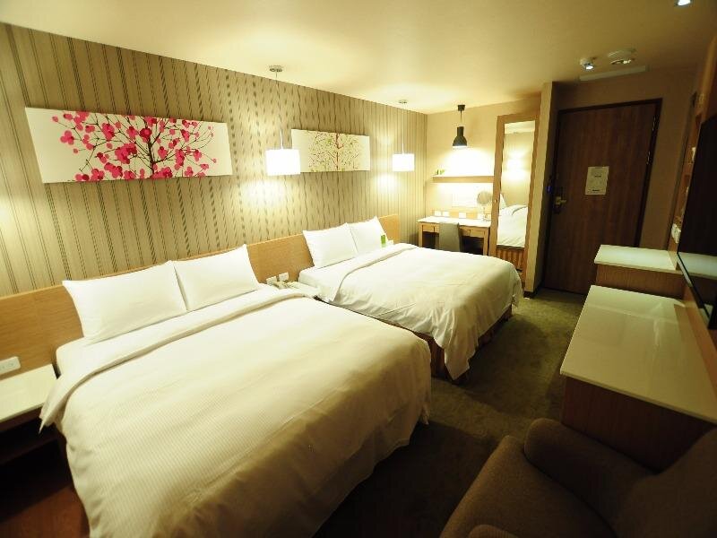 Кровать в общем номере Kindness Hotel Juemin