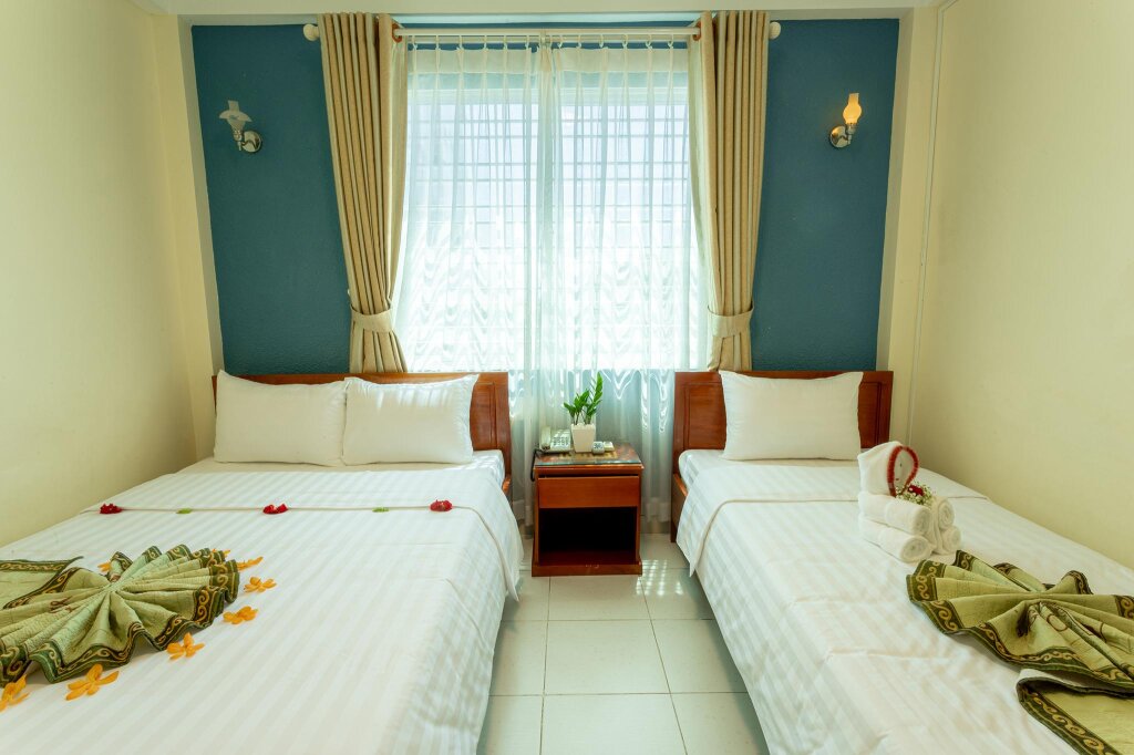 Deluxe triple chambre Amigo Hue Hotel