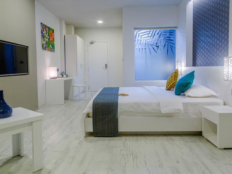 Cama en dormitorio compartido Velana Beach Hotel Maldives