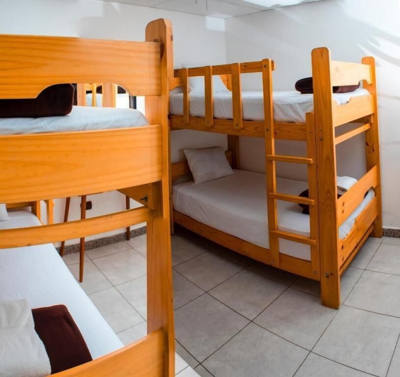 Кровать в общем номере Hotel Resort Thiago
