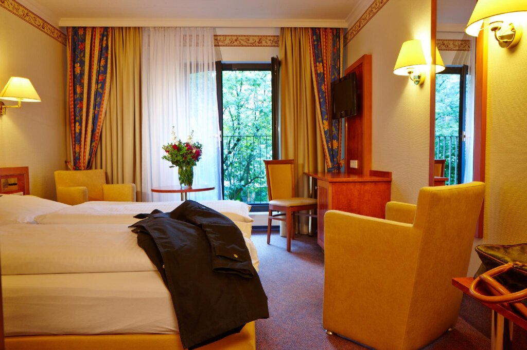 Кровать в общем номере Hotel Concorde