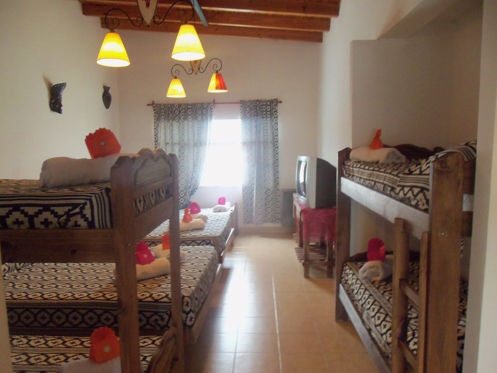 Кровать в общем номере с балконом La Casa de Mia Mama