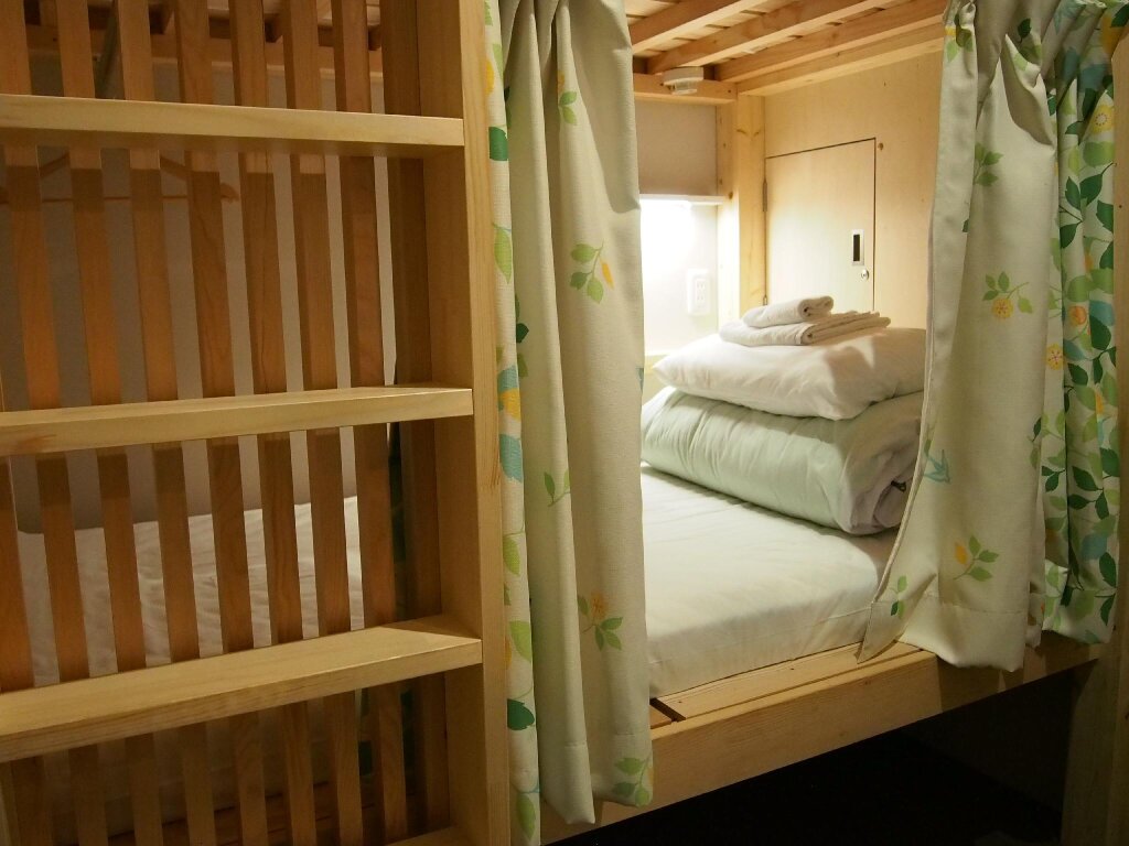 Кровать в общем номере Guesthouse Soi