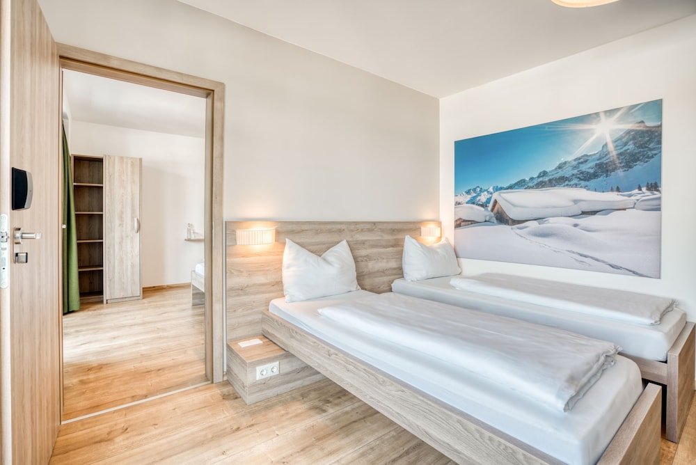 Семейный номер Standard с 2 комнатами с балконом COOEE alpin Hotel Kitzbüheler Alpen