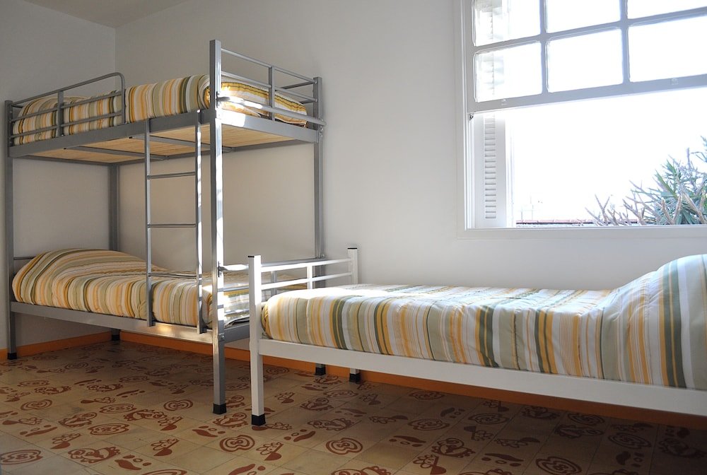 Кровать в общем номере Hostel Alice e Padoca Vegan