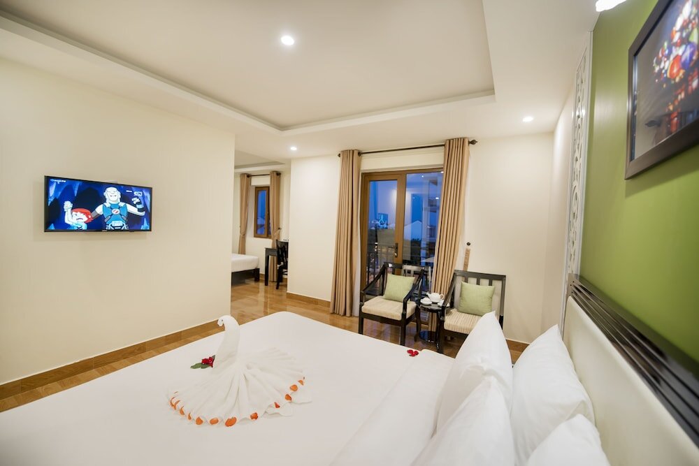 Standard famille chambre avec balcon et Vue sur la ville Hoi An Rose Garden Hotel