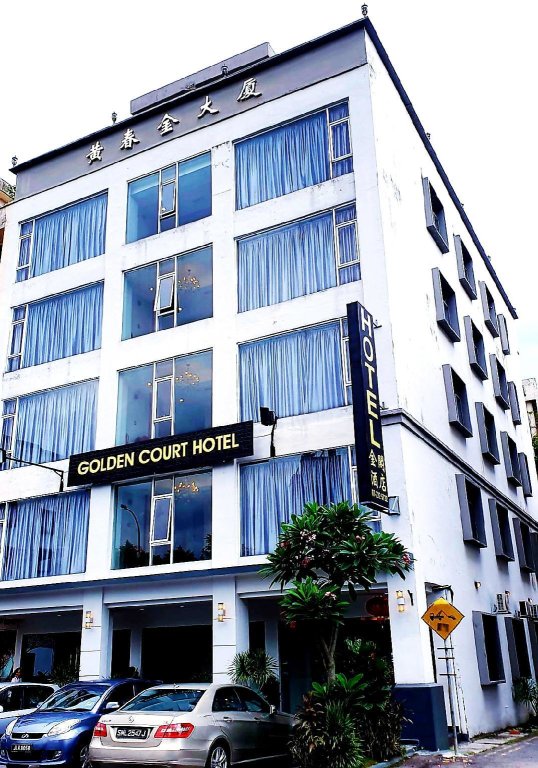 Кровать в общем номере Golden Court Hotel - Sri Pelangi