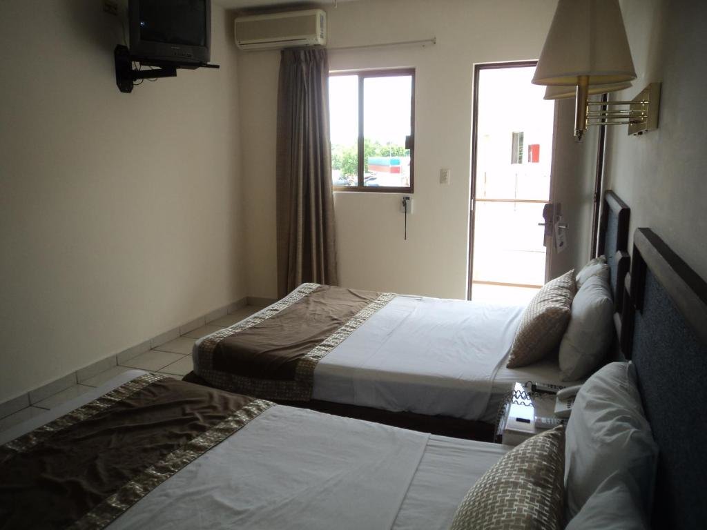 Standard quadruple chambre Hotel Hacienda Nainari