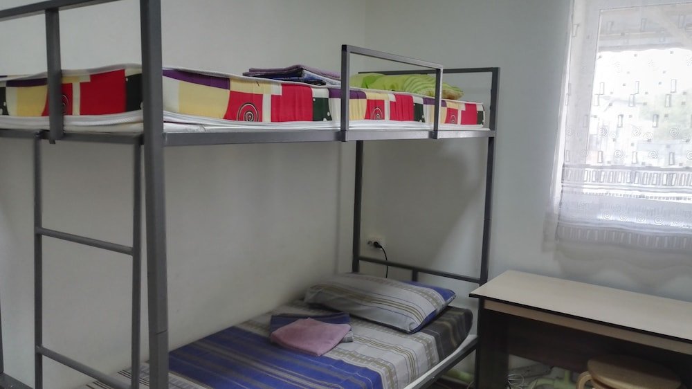Кровать в общем номере (мужской номер) Отель Адмиралъ