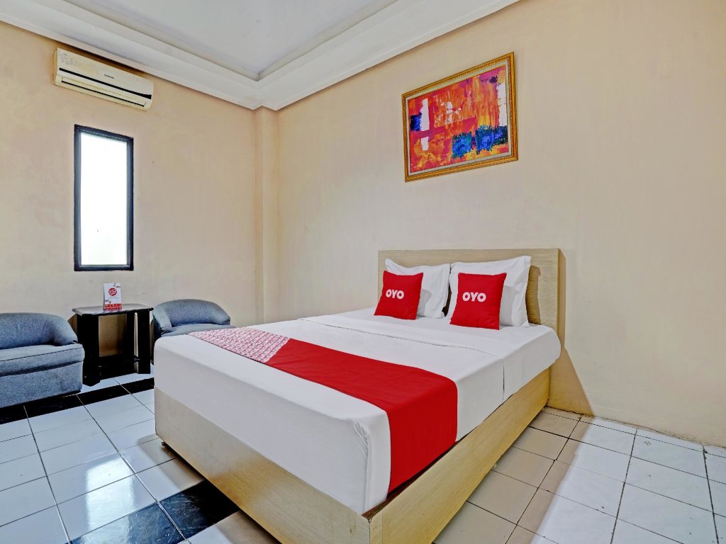 Cama en dormitorio compartido OYO 3953 Hotel Catellya Ii Cipaku