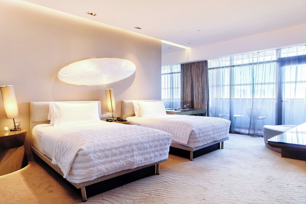 Standard Quadruple room with balcony and with city view Le Meridien Qingdao West Coast Resort
