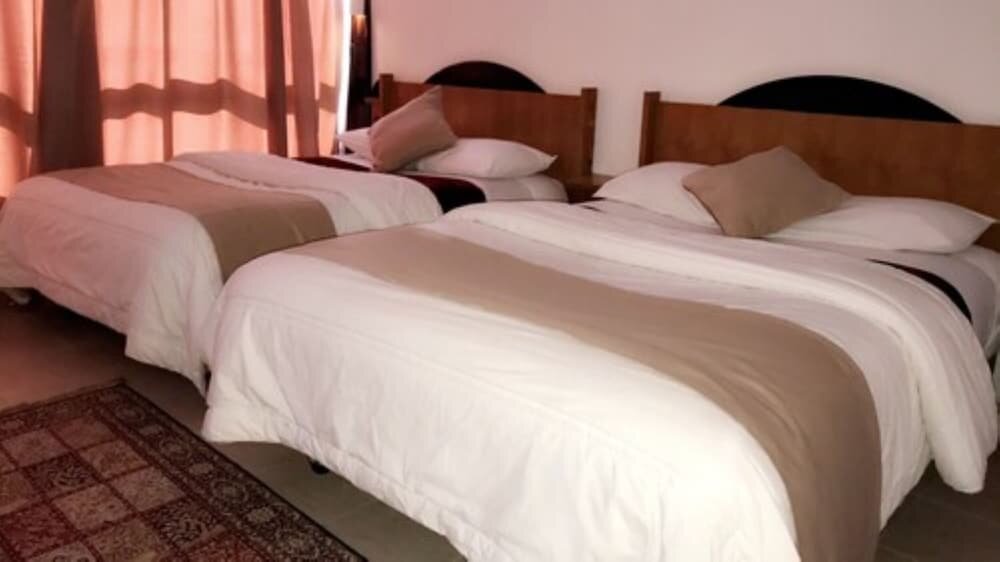 Standard quadruple chambre Hotel Jacaranda