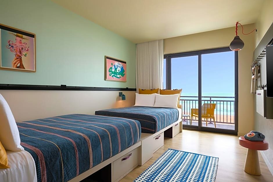 Standard Quadruple room with balcony and oceanfront Moxy Virginia Beach Oceanfront