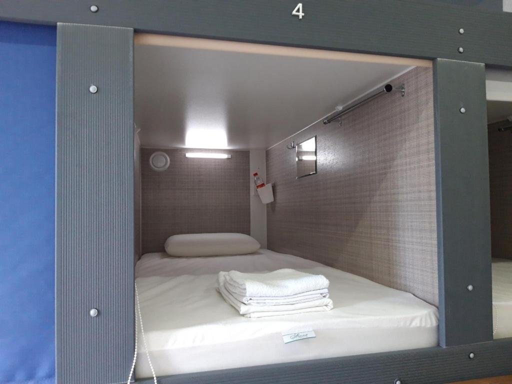 Кровать в общем номере Гостиница Алтек