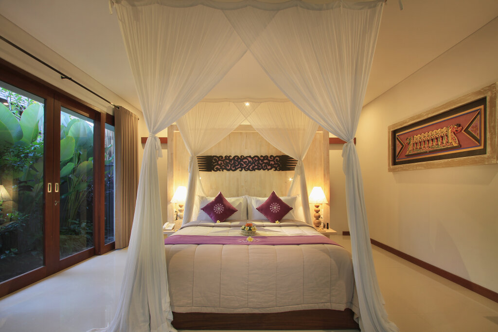 Suite 2 dormitorios con balcón y con vista al jardín Dedary Kriyamaha Ubud by Pramana Villa