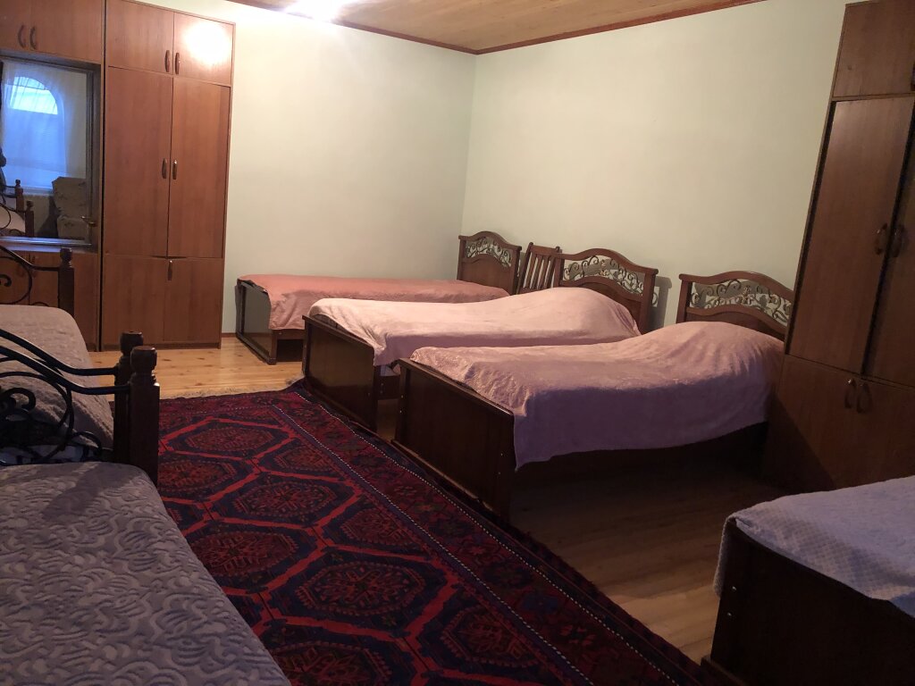 Кровать в общем номере Гостевой дом Уют
