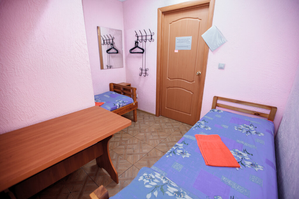Cama en dormitorio compartido AGAT Guest House