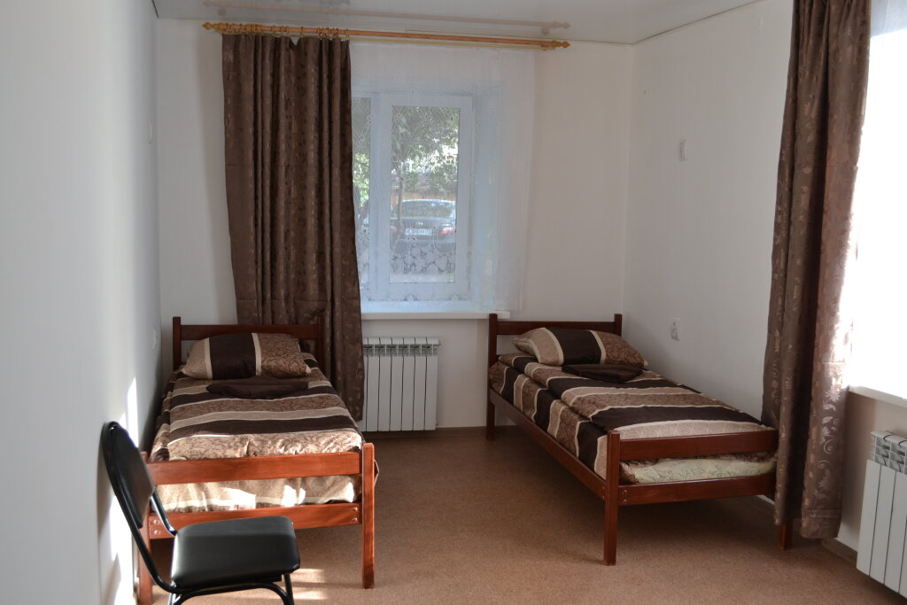 Кровать в общем номере Мини-Отель Шоколад