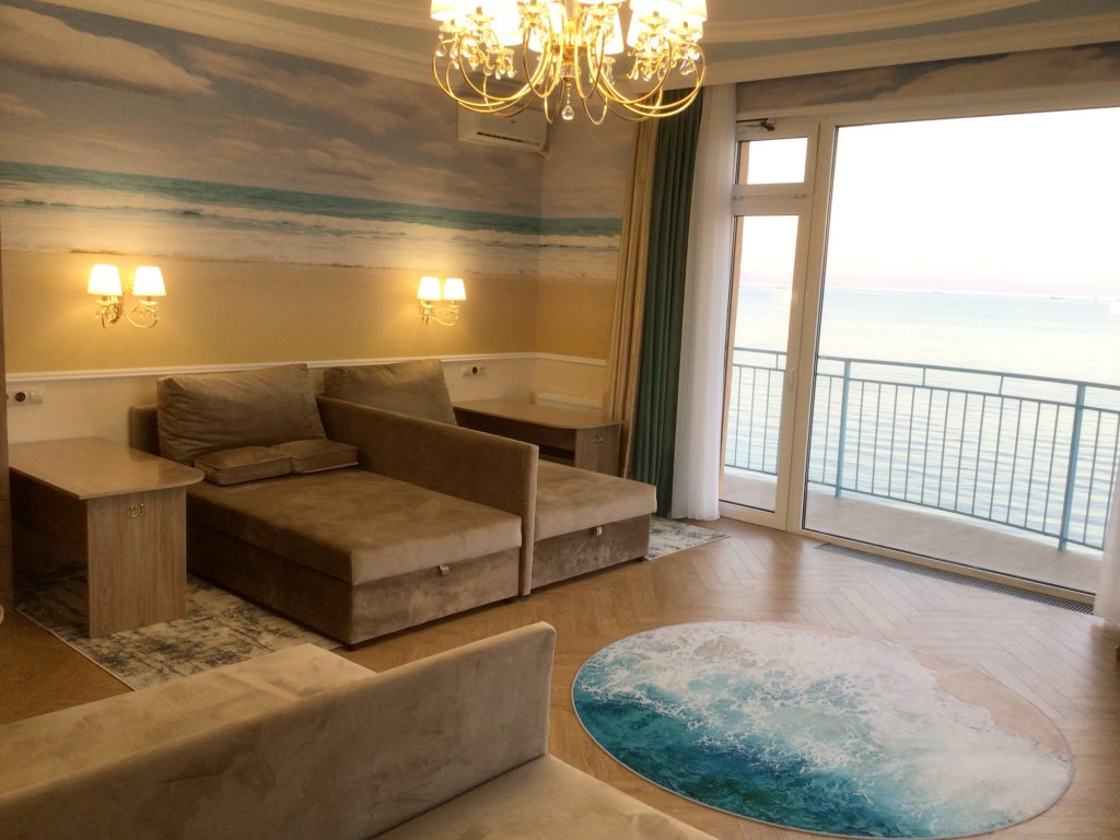 Deluxe Quadruple room with balcony and with sea view Priboy 05 by the sea dlya otdykha i ozdorovlenia Apart-Hotel