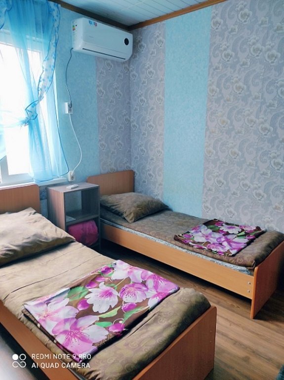 Кровать в общем номере Гостевой дом Онегин