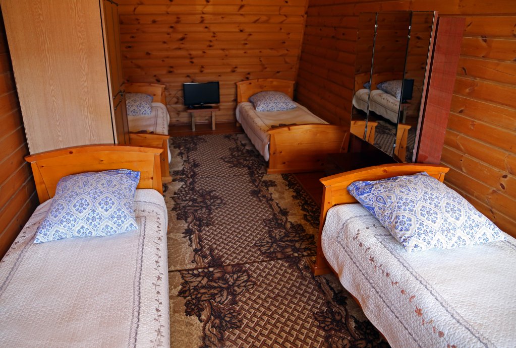 Кровать в общем номере Гостевой Дом Усадьба Набаймар