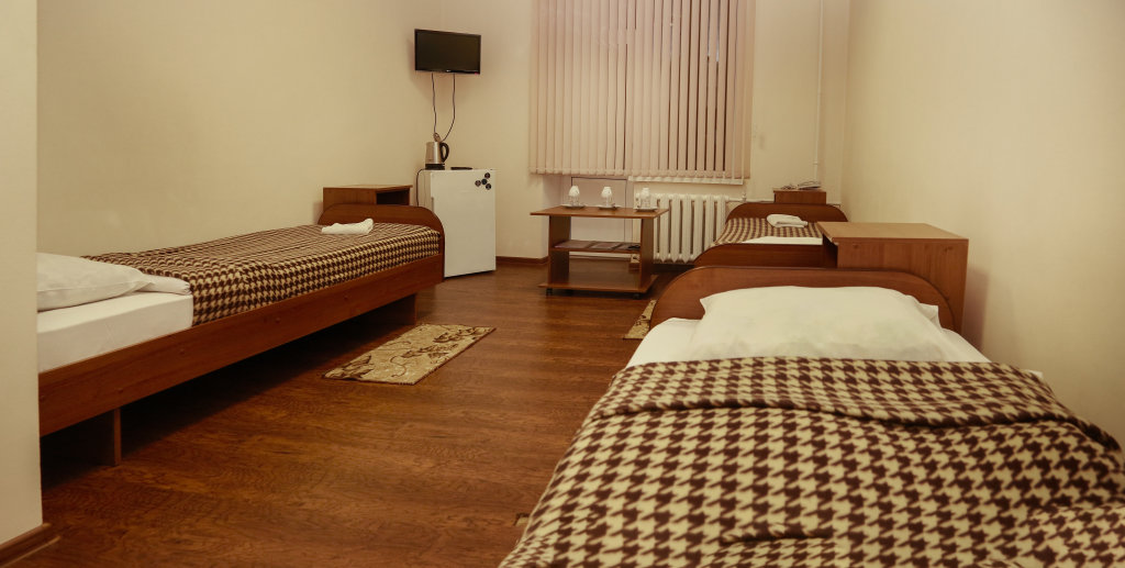 Кровать в общем номере Гостиница Гранат