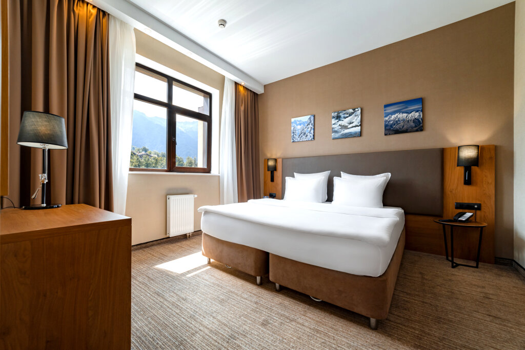 Suite doble familiar 2 dormitorios con balcón y con vista a la montaña Ski Inn Rosa Khutor SPA Hotel