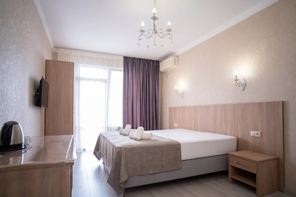 Comfort Quadruple room with balcony Гостевой дом "MoreLeto"