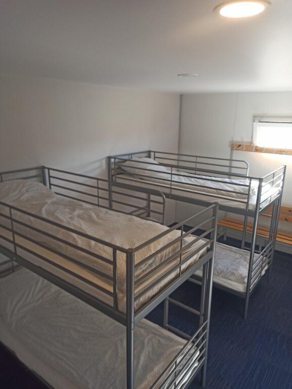 Cama en dormitorio compartido 4active Healthy Center Hotel