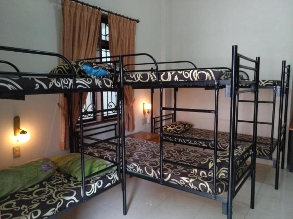 Кровать в общем номере Dazhong Backpacker's Hostel